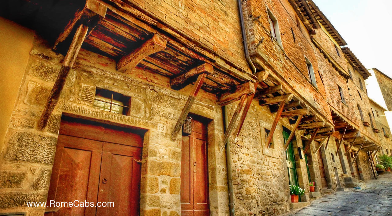 Cortona via Janelli Medieval houses Tours of Tuscany from Rome